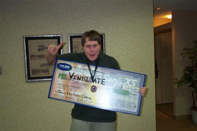Chris Brennan holding a Team Fortress Classic championship prize check