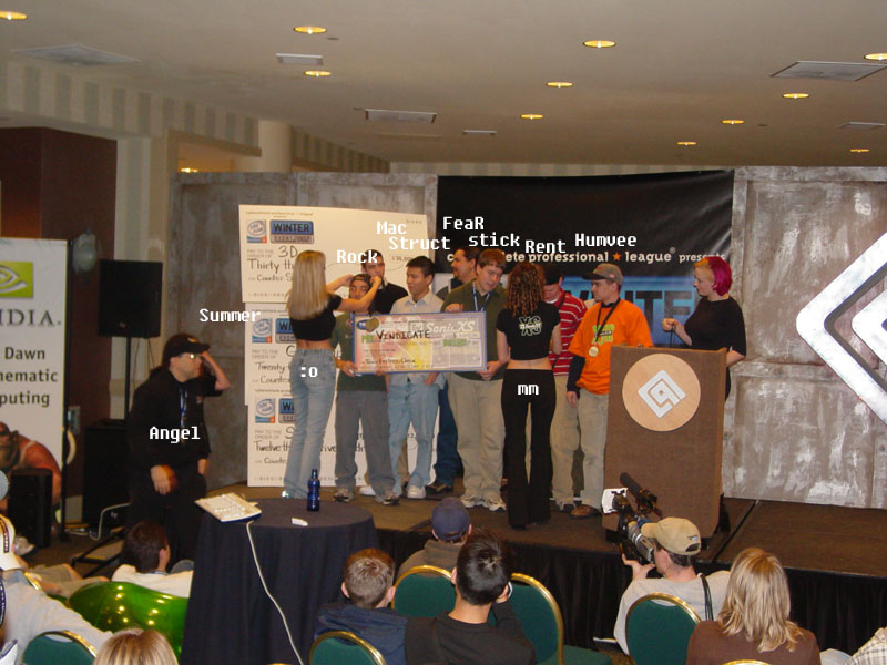 Team Vindicate receiving the Team Fortress Classic championship award on the CPL stage